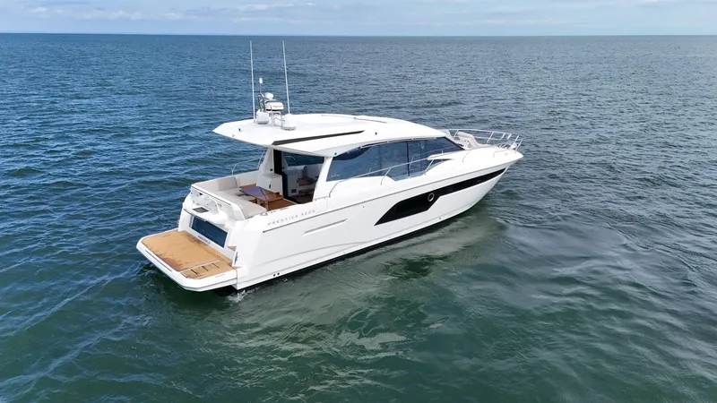 Slide: The Image of 2019 Prestige 520S yacht cruising on open sea, showcasing sleek design and luxury features. - 17