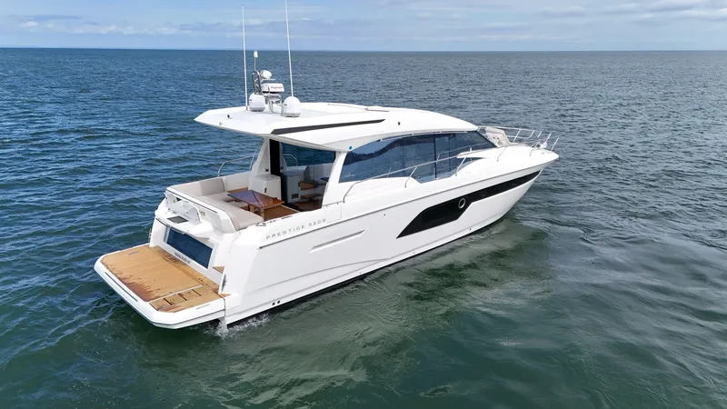 Slide: The Image of 2019 Prestige 520S yacht cruising on open water, showcasing sleek design and luxury features. - 18