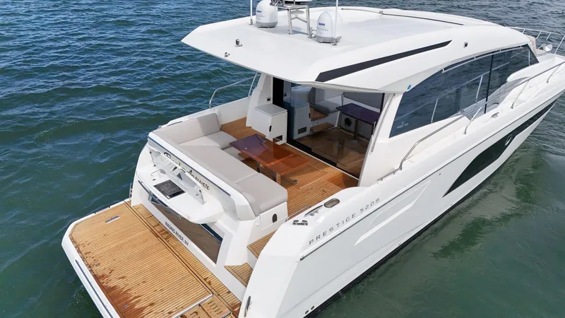 Slide: The Image of 2019 Prestige 520S yacht on water, featuring sleek design and spacious deck. - 27