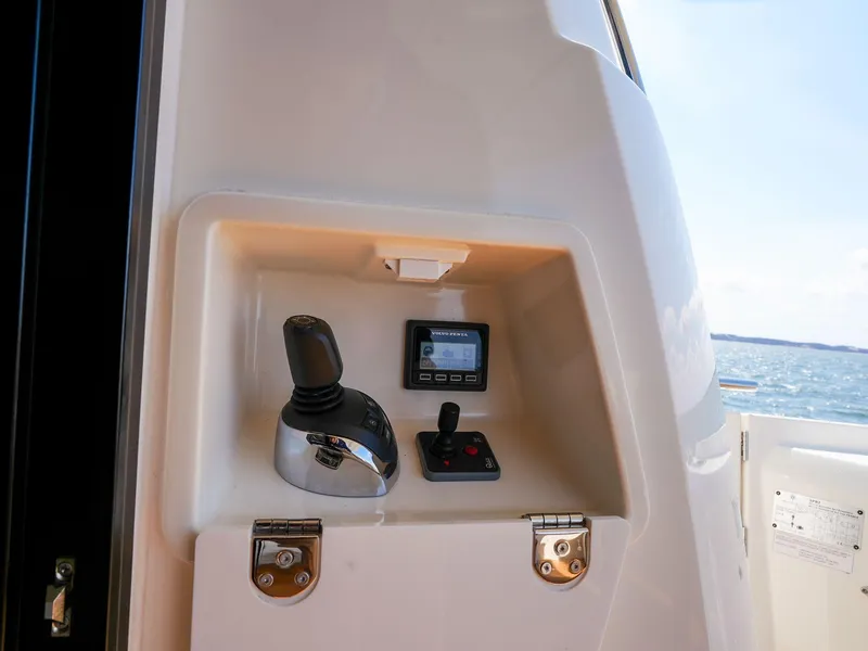 Slide: The Image of Control panel on a 2019 Prestige 520S yacht, featuring joystick and display. - 37