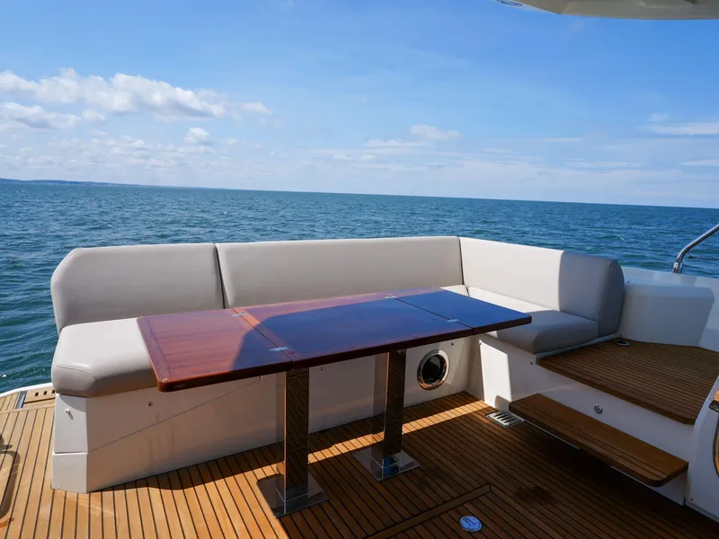 Slide: The Image of Luxurious 2019 Prestige 520S yacht deck with seating and ocean view. - 40