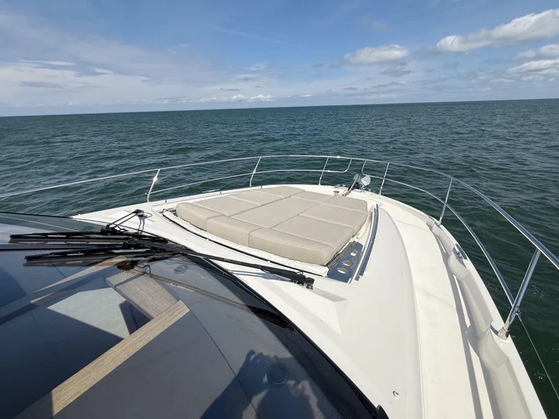 Slide: The Image of Prestige 520S 2019 yacht on open sea with sun deck, clear sky, and calm waters. - 46