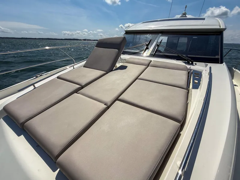 Slide: The Image of Luxurious sunbathing deck on 2019 Prestige 520S yacht under clear blue sky. - 47