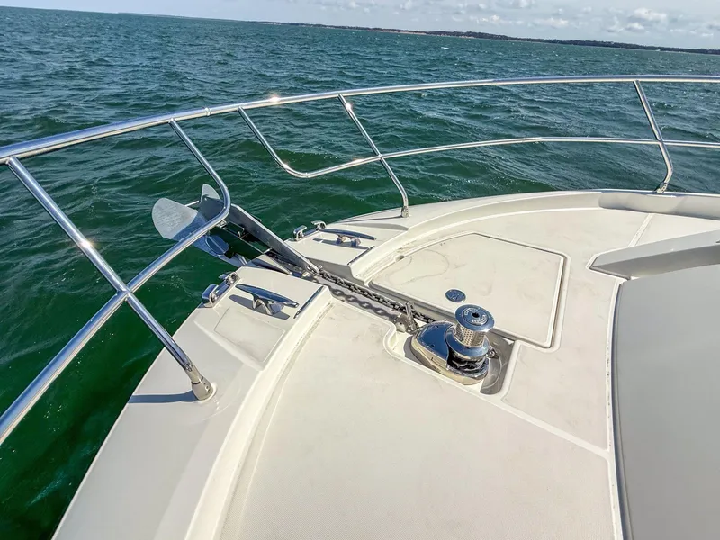Slide: The Image of 2019 Prestige 520S yacht bow with anchor, cruising on open water. - 49