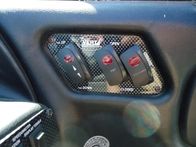 Slide: The Image of Control panel of a 2009 Calabria Pro V II boat with toggle switches. - 11
