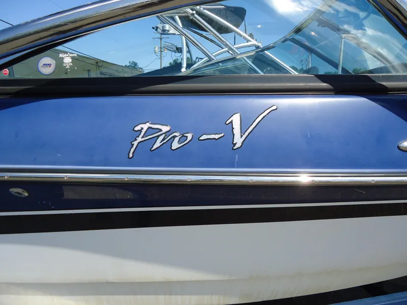 Slide: The Image of 2009 Calabria Pro V II boat with blue and white exterior detailing. - 18