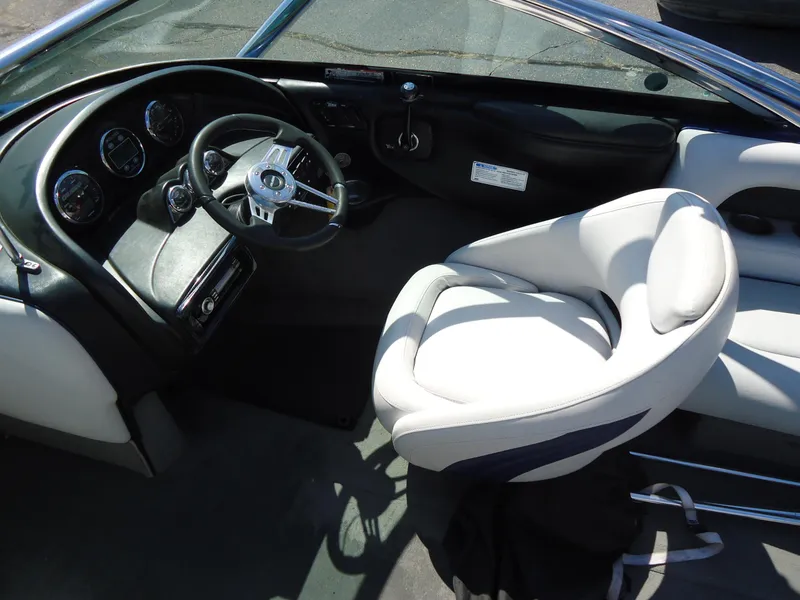 Slide: The Image of Interior of a 2009 Calabria Pro V II boat with steering wheel and gauges. - 5