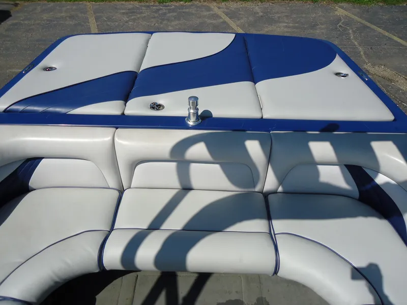 Slide: The Image of 2009 Calabria Pro V II boat interior with blue and white cushioned seating. - 7