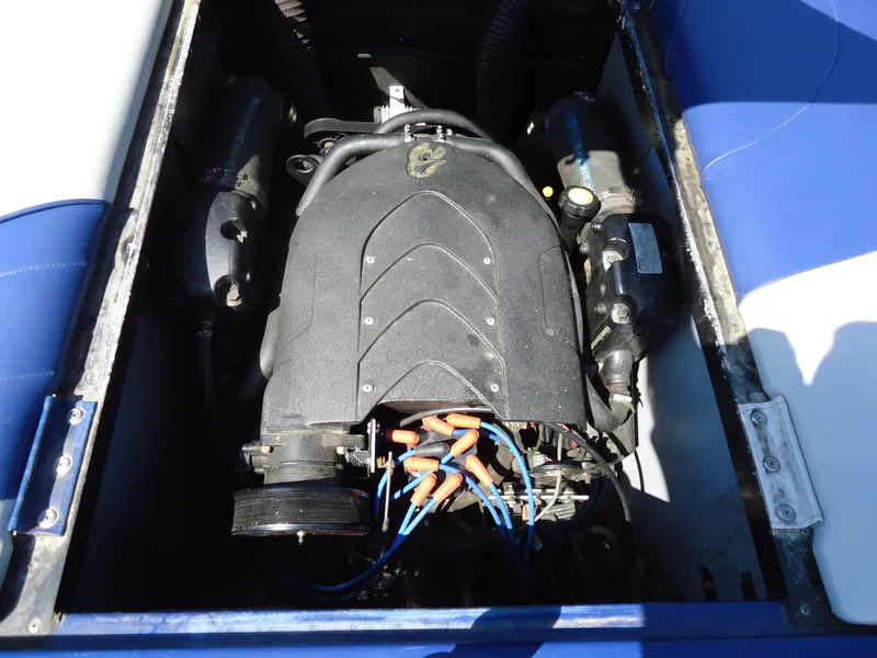 Slide: The Image of 2009 Calabria Pro V II boat engine compartment with visible components and wiring. - 8
