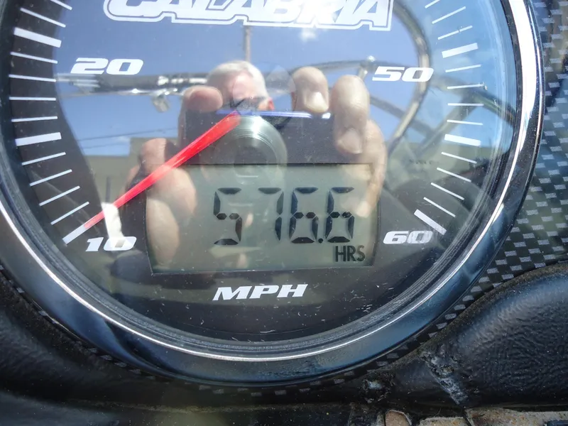 Slide: The Image of Calabria Pro V II 2009 speedometer showing 57.6 hours, MPH gauge visible. - 9