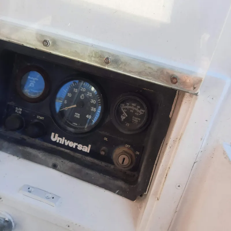 Slide: The Image of Instrument panel of a 1984 Cheoy Lee Sloop with Universal engine controls. - 7