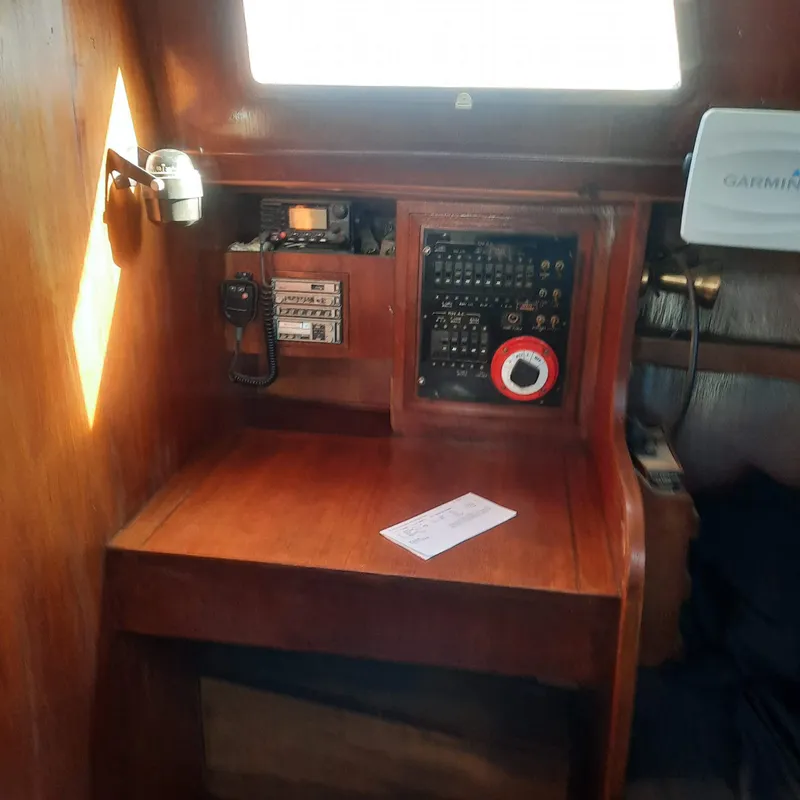 Slide: The Image of 1984 Cheoy Lee Sloop interior with navigation equipment and control panel. - 9