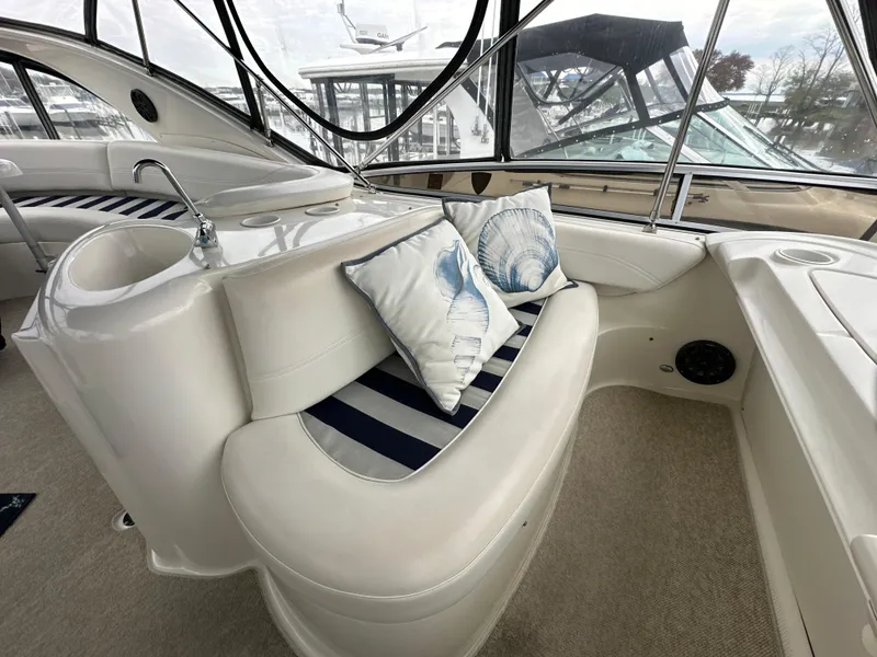 Slide: The Image of Luxurious 2008 Meridian 391 Sedan yacht interior with striped seating and decorative pillows. - 17