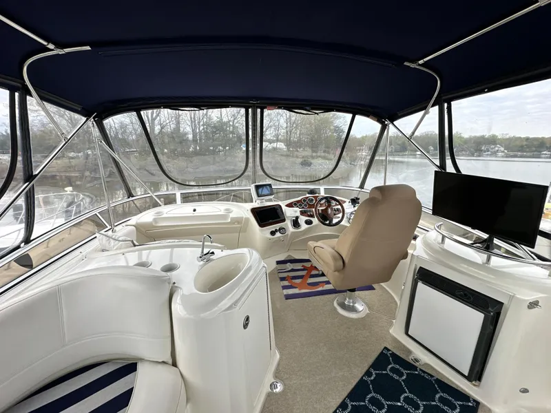 Slide: The Image of 2008 Meridian 391 Sedan interior with helm, seating, and panoramic windows. - 2