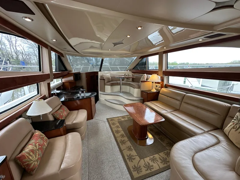 Slide: The Image of Luxurious interior of a 2008 Meridian 391 Sedan yacht with elegant seating and panoramic windows. - 21