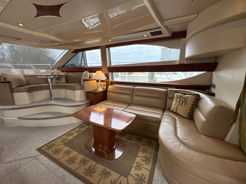Slide: The Image of Luxurious interior of a 2008 Meridian 391 Sedan yacht with elegant seating and wooden table. - 24