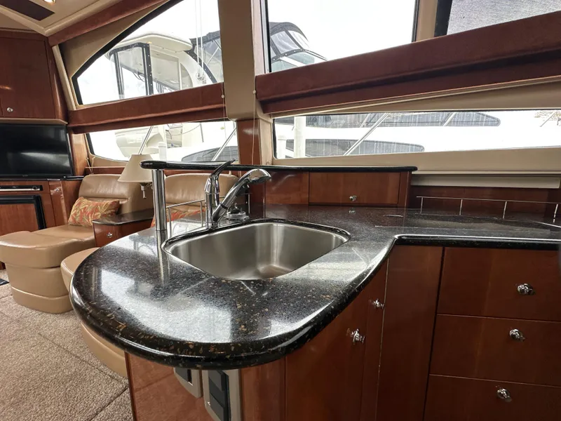 Slide: The Image of 2008 Meridian 391 Sedan yacht interior with sleek kitchen and modern amenities. - 28