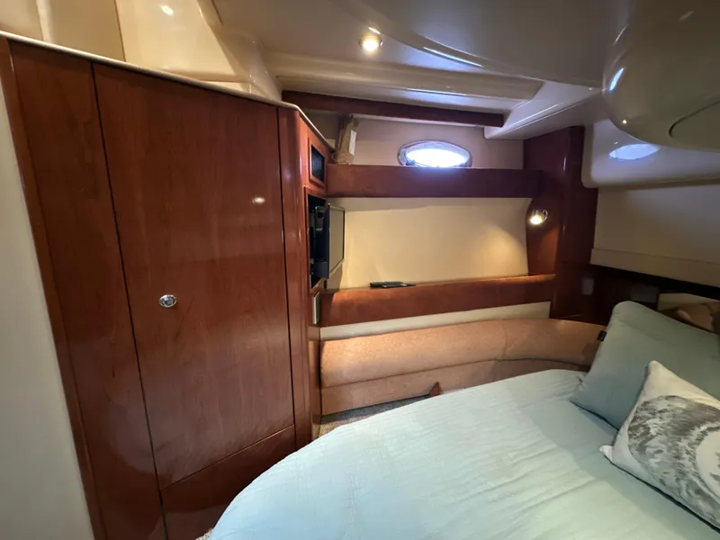 Slide: The Image of Luxurious interior of a 2008 Meridian 391 Sedan yacht with wood finishes and cozy seating. - 34
