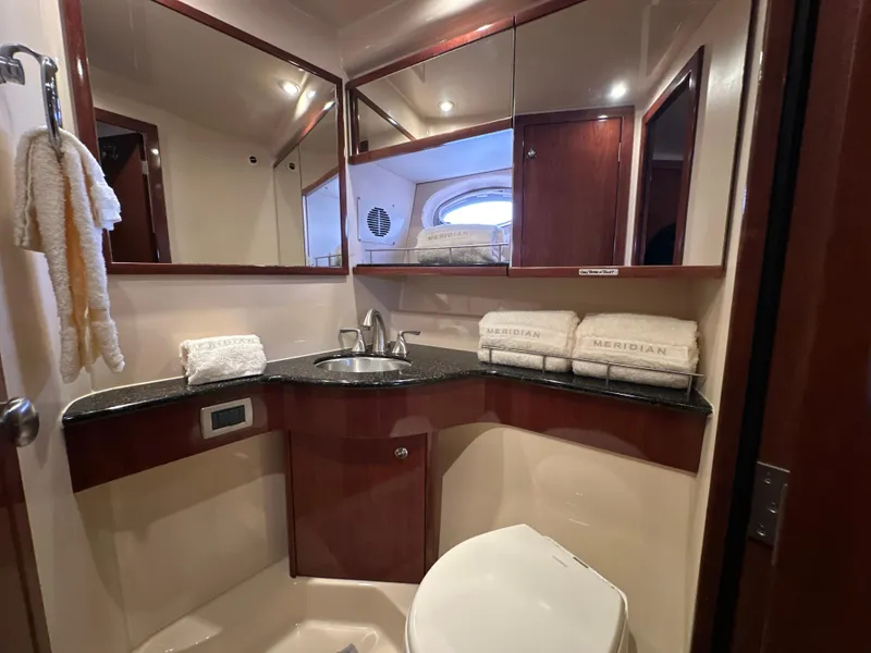 Slide: The Image of Luxurious bathroom in 2008 Meridian 391 Sedan yacht with elegant fixtures and towels. - 36