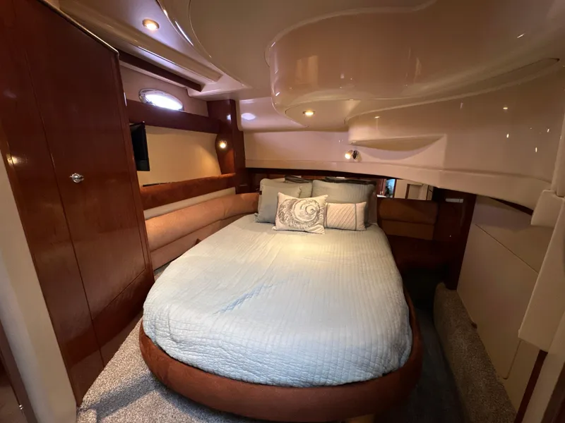 Slide: The Image of Luxurious cabin interior of 2008 Meridian 391 Sedan yacht with cozy bed and elegant wood finishes. - 37