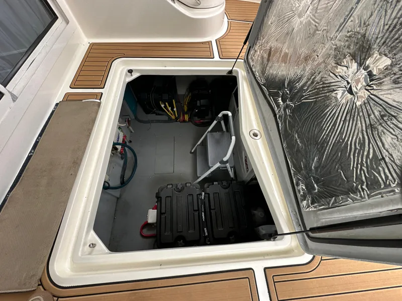 Slide: The Image of Engine compartment of 2008 Meridian 391 Sedan, showcasing interior components and storage. - 40