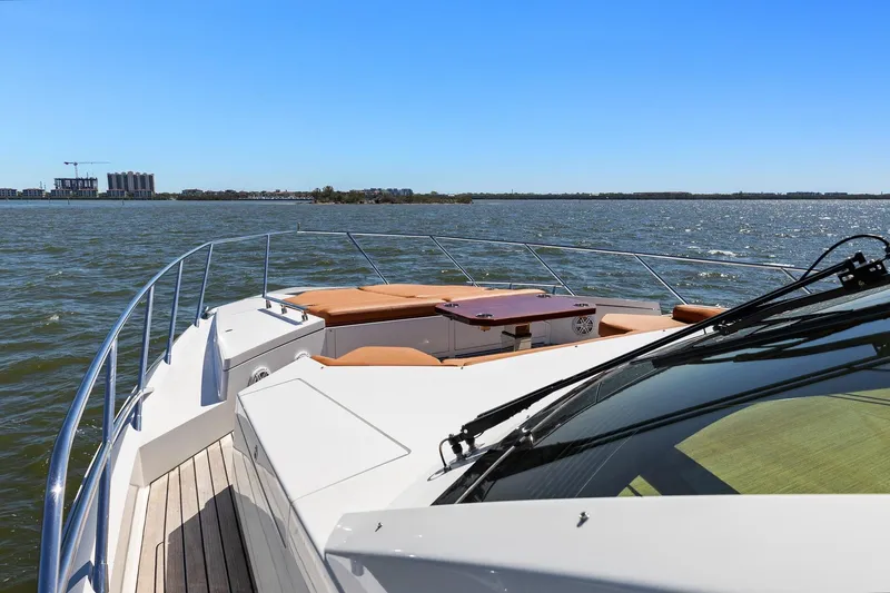 Slide: The Image of 2013 Cheoy Lee 76 Alpha yacht cruising on open water under clear blue skies. - 13
