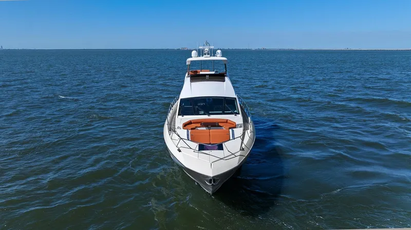 Slide: The Image of 2013 Cheoy Lee 76 Alpha yacht cruising on open water under clear blue skies. - 28