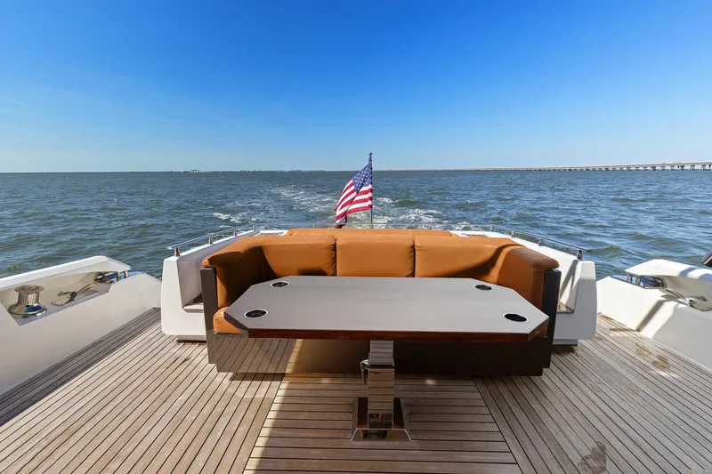 Slide: The Image of Cheoy Lee 76 Alpha yacht deck with seating, table, and American flag, 2013 model. - 30