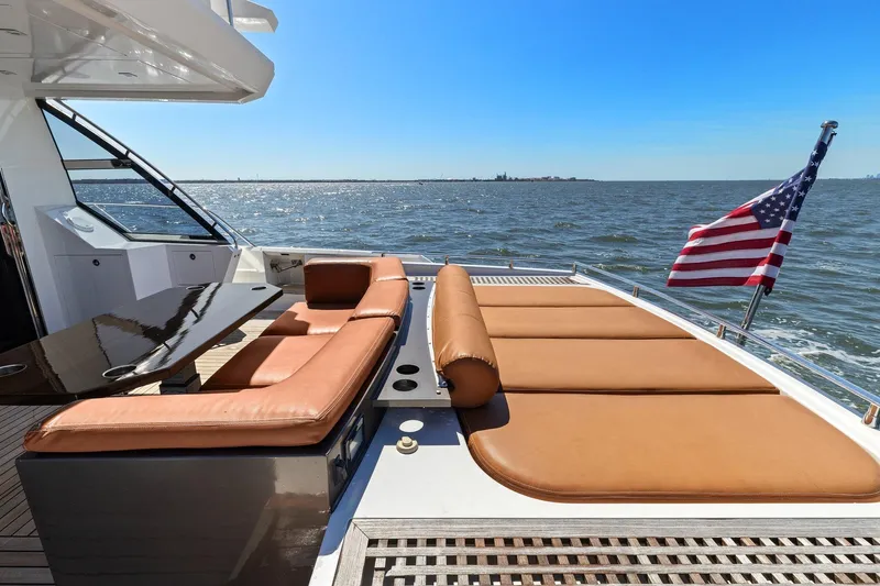 Slide: The Image of Luxurious 2013 Cheoy Lee 76 Alpha yacht with sun loungers and American flag on deck. - 32