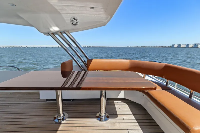 Slide: The Image of Luxury outdoor seating on 2013 Cheoy Lee 76 Alpha yacht, overlooking serene ocean view. - 35