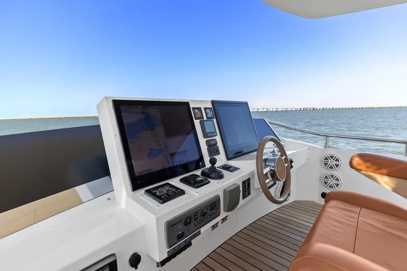 Slide: The Image of Helm of 2013 Cheoy Lee 76 Alpha yacht with modern navigation equipment and ocean view. - 40