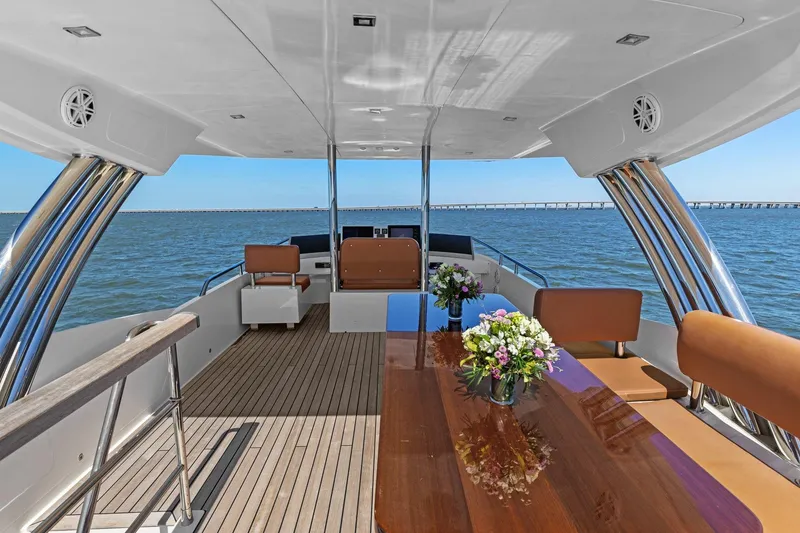 Slide: The Image of Luxurious 2013 Cheoy Lee 76 Alpha yacht deck with elegant seating and ocean view. - 44