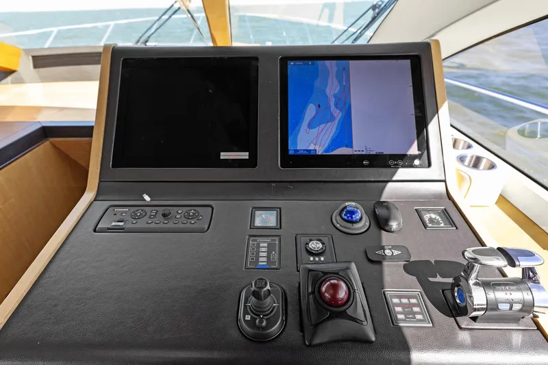 Slide: The Image of Control panel of 2013 Cheoy Lee 76 Alpha yacht with navigation screens and controls. - 46