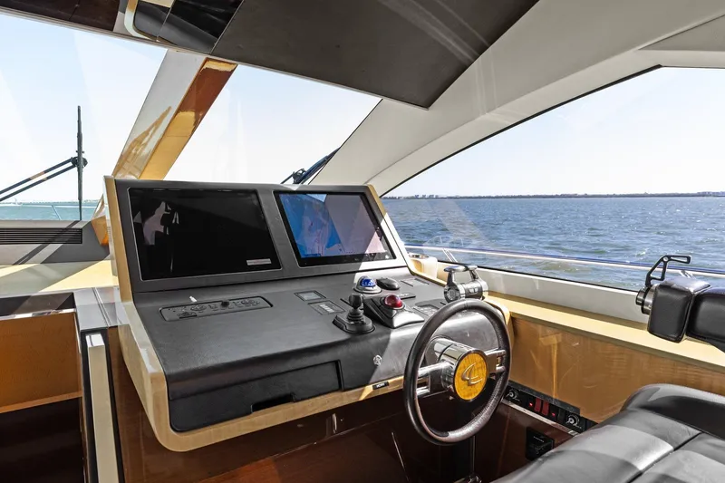 Slide: The Image of Helm of 2013 Cheoy Lee 76 Alpha yacht with modern navigation equipment. - 49