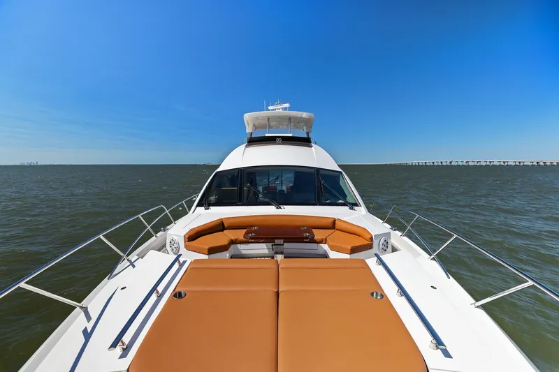 Slide: The Image of 2013 Cheoy Lee 76 Alpha yacht on open water, featuring spacious deck and luxurious seating. - 8