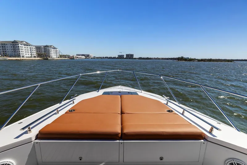 Slide: The Image of Bow view of 2013 Cheoy Lee 76 Alpha yacht with sunpads, cruising on open water. - 9