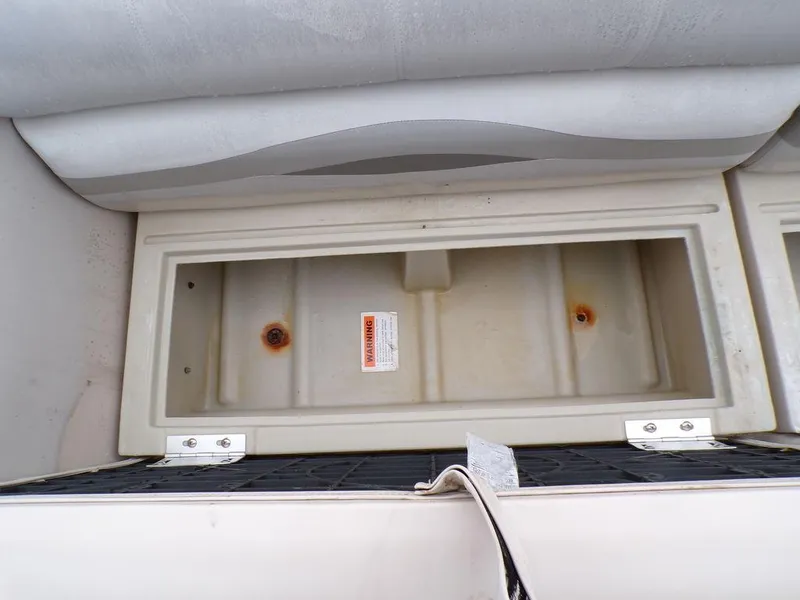 Slide: The Image of Storage compartment of a 2000 Crest Crest II DL boat, showing interior details. - 13