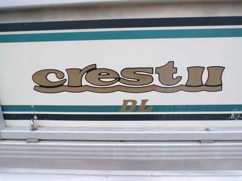 Slide: The Image of Crest II DL 2000 model logo with teal and gold accents. - 6