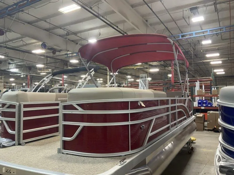 Slide: The Image of 2025 Bennington S Swingback 22 SSB pontoon boat in a warehouse setting. - 17