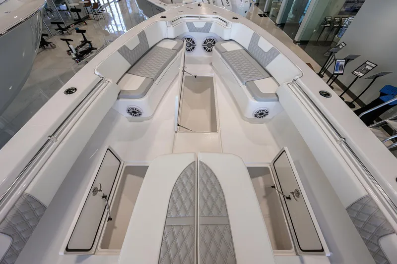 Slide: The Image of 2025 Contender 39 ST boat interior with spacious seating and storage compartments. - 11