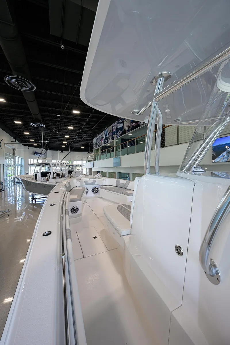 Slide: The Image of 2025 Contender 39 ST boat interior in showroom, showcasing sleek design and modern features. - 15