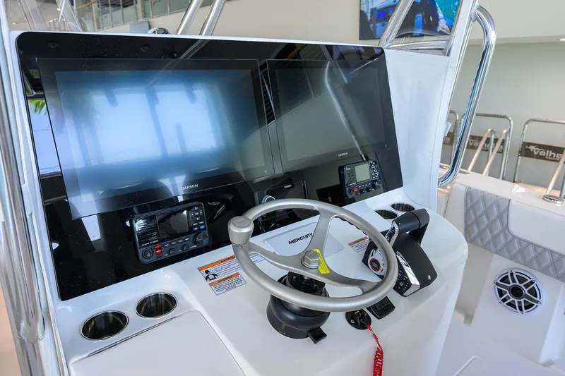 Slide: The Image of 2025 Contender 39 ST boat dashboard with modern navigation screens and controls. - 22