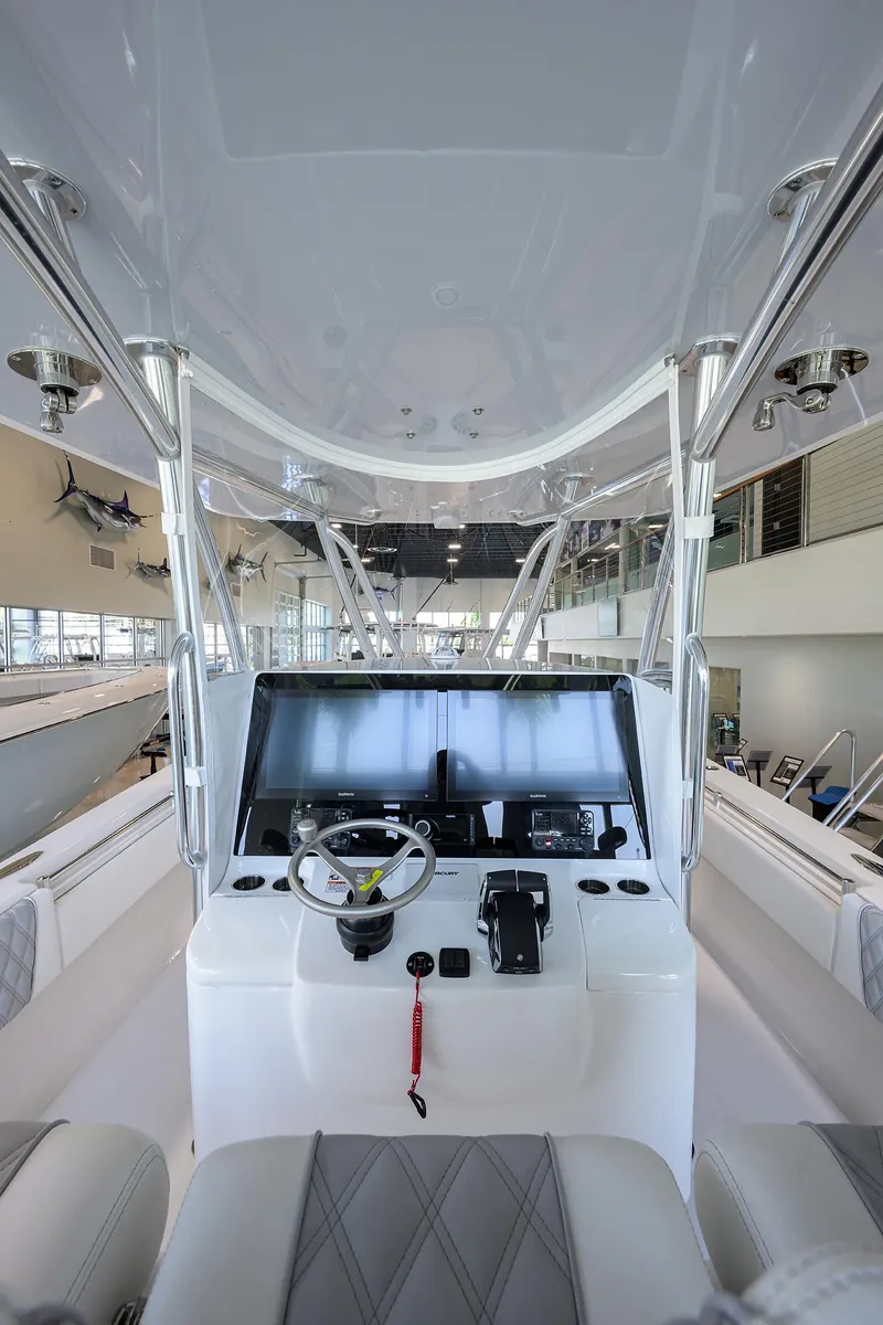 Slide: The Image of 2025 Contender 39 ST boat interior with modern helm and controls. - 24