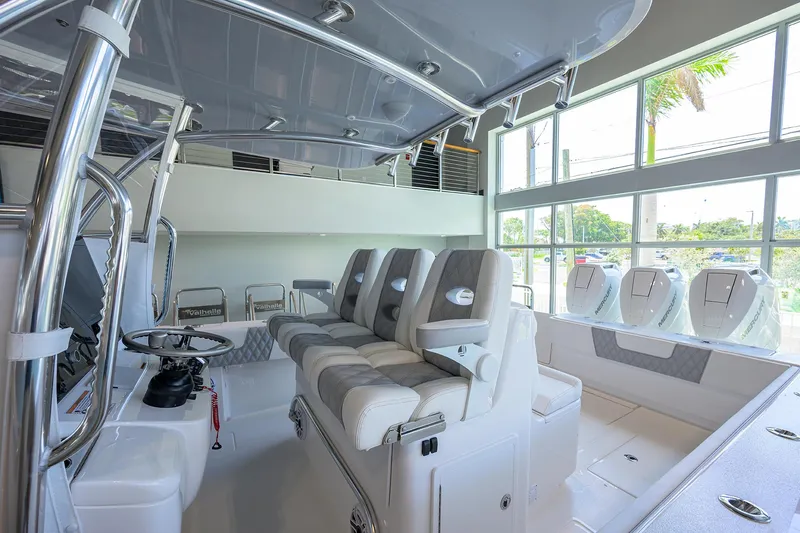 Slide: The Image of 2025 Contender 39 ST boat interior with modern seating and controls. - 30