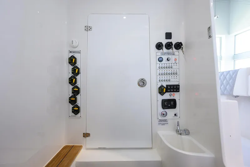 Slide: The Image of Interior of 2025 Contender 39 ST boat, featuring control panel and seating area. - 35