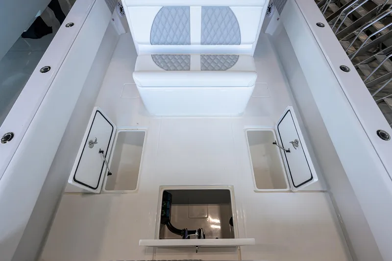 Slide: The Image of 2025 Contender 39 ST boat interior with storage compartments and seating. - 37