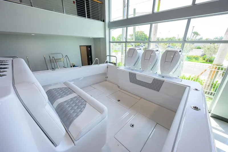 Slide: The Image of 2025 Contender 39 ST boat interior with modern seating and powerful engines. - 42