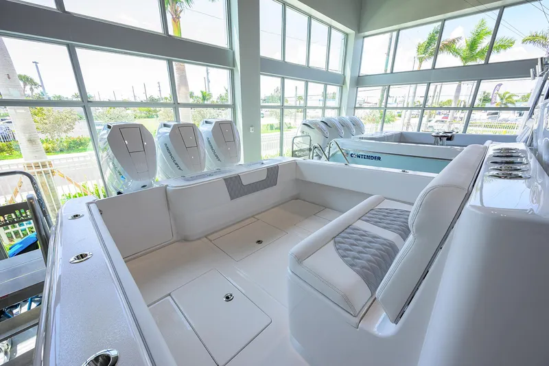 Slide: The Image of 2025 Contender 39 ST boat interior with seating and multiple outboard engines. - 44