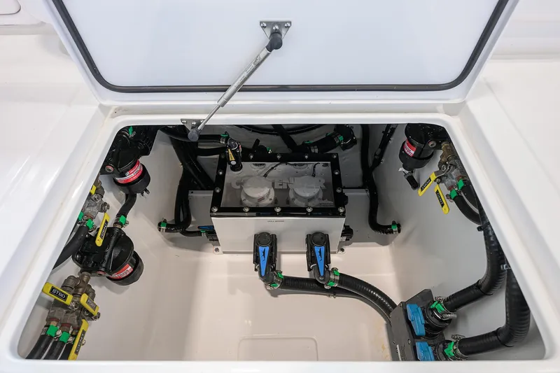 Slide: The Image of 2025 Contender 39 ST boat compartment with advanced plumbing and wiring systems. - 46