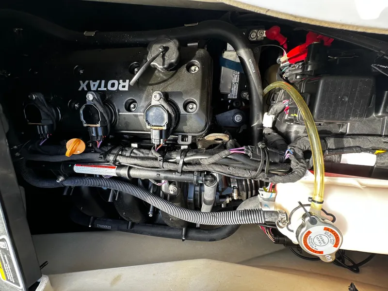 Slide: The Image of 2023 Sea-Doo Fish Pro Scout engine compartment with Rotax components and wiring. - 3